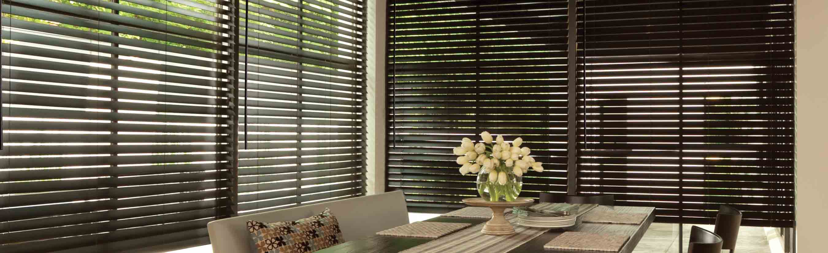 Dark wood blinds in a kitchen.