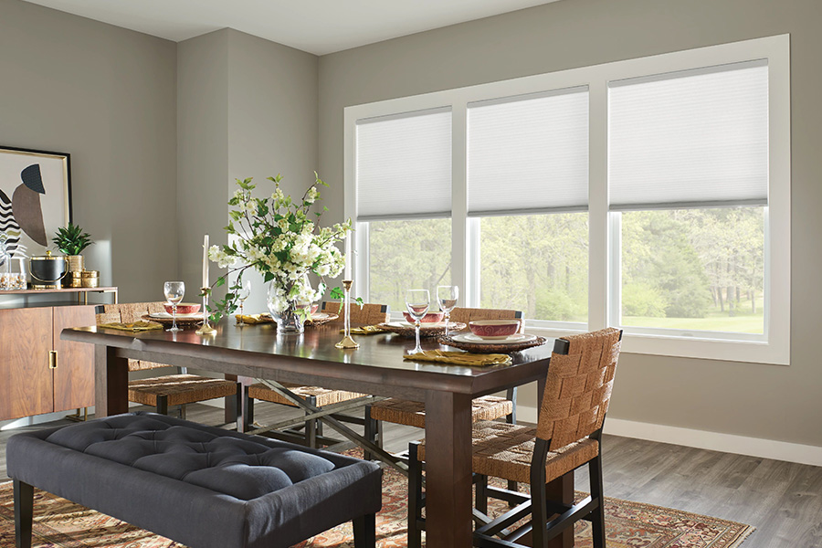 White cellular shades on shallow dining room windows