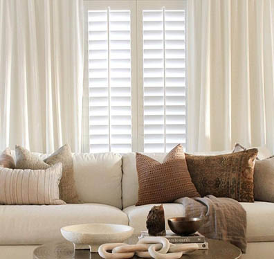 living room with white shutters