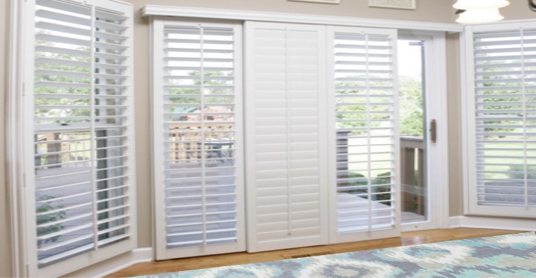 Plantation shutters on a sliding glass door in Fort Myers