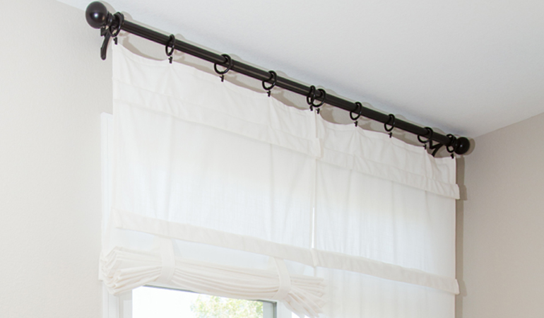 Tumble shades in Fort Myers give your doors privacy versatility and style. White tumble shade on double glass doors